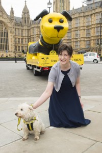 Alison Thewliss petting a dog at the launch of the Dogs Trust ad campaign